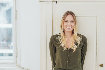 Smiling happy woman posing indoors