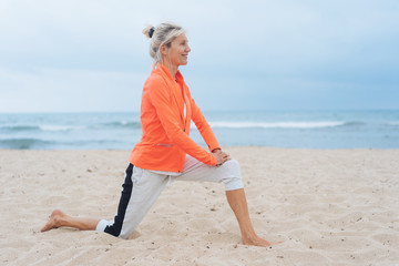 Active healthy woman doing stretching exercises