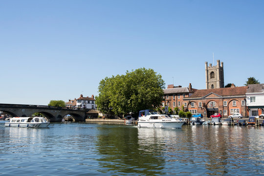 Skyline Of Henley On Thames In Oxfordshire UK With River Thames In Foreground