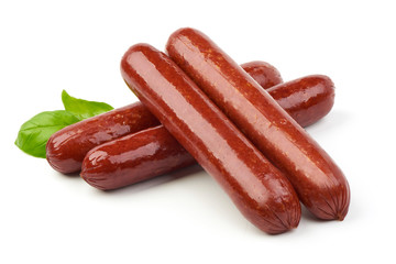 Smoked sausages with fresh herbs, isolated on white background.