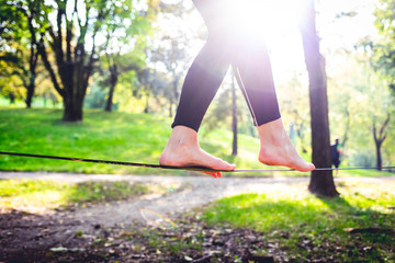 middle section human feet slacklining - balance, sport, tightrope concept