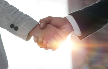 Business people shaking hands isolated on white background