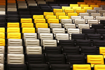 line of color chairs in auditorium