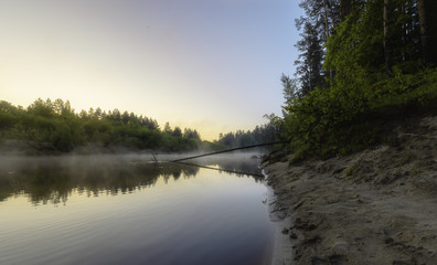 Fototapeta na wymiar Fog over the morning river