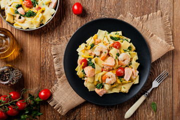 Traditional Italian fettuccini with salmon, shrimp and spinach.