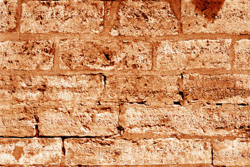 Ancient stone wall in orange tone.