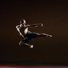 Fototapeta na wymiar A kick to the side of an athlete beats in a high jump
