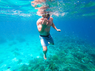 Man inviting you to come snorkelling with him in Cebu, Phillipines.