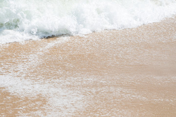 HDR shot of sea shore with wave and white sand during summer day in thailand (selective focus and white balance / color tone shift )