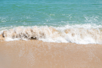 HDR shot of sea shore with wave and white sand during summer day in thailand (selective focus and white balance / color tone shift )