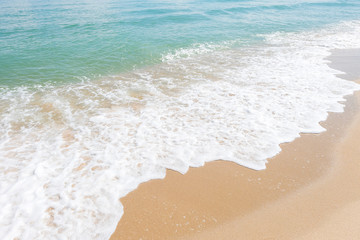 HDR shot of sea shore with wave and white sand during summer day in thailand (selective focus and...