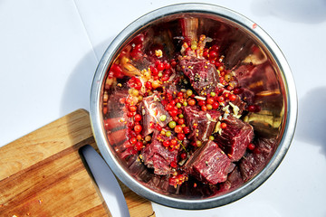 sliced fresh raw beef with berries sauce