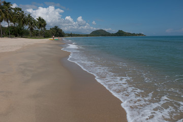 HDR shot of sea shore with wave and white sand during summer day in thailand (selective focus and white balance / color tone shift )