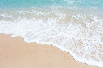 HDR shot of sea shore with wave and white sand during summer day in thailand (selective focus and white balance / color tone shift )