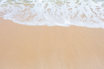 HDR shot of sea shore with wave and white sand during summer day in thailand (selective focus and white balance / color tone shift )