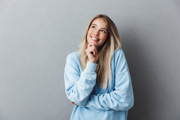 Portrait of a lovely young girl in blue sweatshirt
