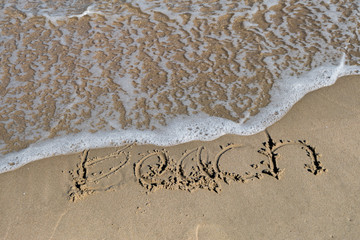 HDR shot of sea shore with wave and white sand during summer day in thailand (selective focus and...
