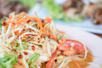 Thai Cuisine, Green papaya salad, call somtom in Thai with selective focus