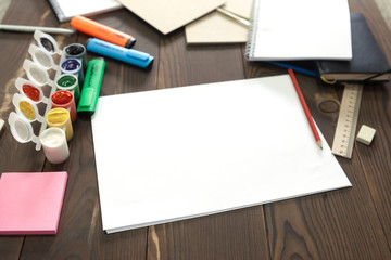 the girl draws a pencil in a notebook