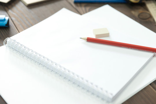 the girl draws a pencil in a notebook