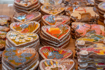 Fototapeta na wymiar Different gingerbread hearts in the store on the table.