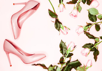Obraz na płótnie Canvas Beauty blog concept. pink nude female shoeson white background. Flat lay, top view trendy fashion feminine background.