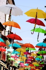 Fototapeta na wymiar Street with Umbrellas