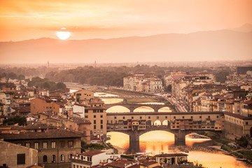 Fototapeta na wymiar Aerial view of Florence at sunset with the Ponte Vecchio and the Arno river, Tuscany, Italy