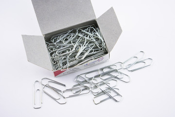 Box with paper clips to white background.