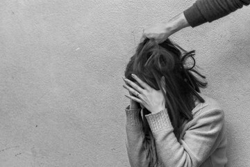 Man beating up his wife illustrating domestic violence
