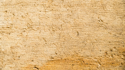 Background of old yellow stone texture.