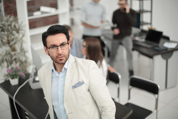 confident businessman on the background of the office