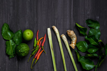 Top view of Spices, Tom Yum on the old gray wood floor. thai food. Spicy spicy. Background layout with free text space.