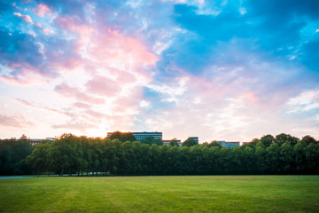 sunset in a park overlooking the city