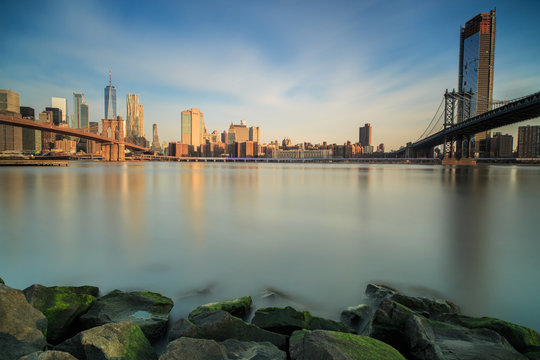 View on downtown manhattan with Brooklyn and manhattan bridge from the rocks during sunrise