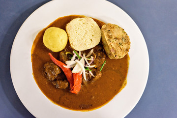 Beef stew with sauce and red chili pepper