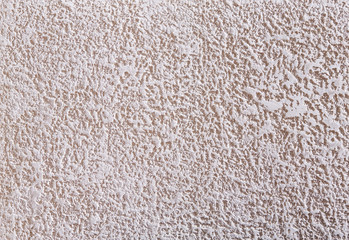 Beige plaster textured background. Abstact beige stucco. Texture of plaster on the wall.