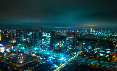 Obraz na płótnie Canvas Aerial view over Tokyo by night - beautiful city lights