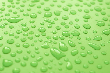 Water droplets on green background.Close up shot of dew drops on green background.