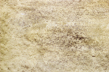 Abstract texture of decorative plaster. Grunge background of stucco texture. Brown grained surface.