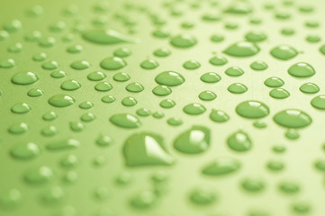 Water droplets on green background.Close up shot of dew drops on green background.