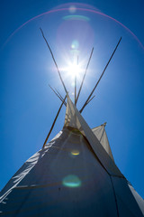 Aboriginal teepee illuminated by the sun