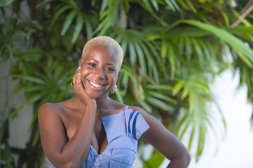 lifestyle portrait of young attractive and joyful black african american woman smiling happy posing...