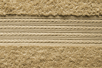 Element of Beige BathTowel. Fleecy Decorative Element with Braided Pigtails. Bathroom Accessories Background