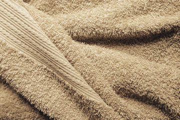 Beige Bath Towel. Folded Towel Texture. Bathroom Accessories Background