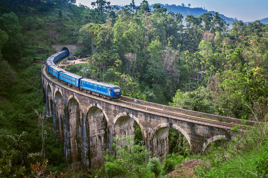 Train on Nine arch Bridge in Sri Lanka. Beautiful train track in hill country. Old bridge in Ceylon.