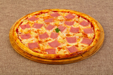 Pizza with ham and pineapple