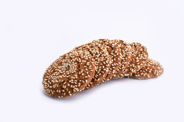 Isolated on white. Several oatmeal cookies with sesame seeds