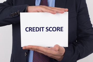 Man showing paper with CREDIT SCORE text