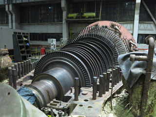 Disassembled steam turbine in the process of generator repair at power plant © alexrow